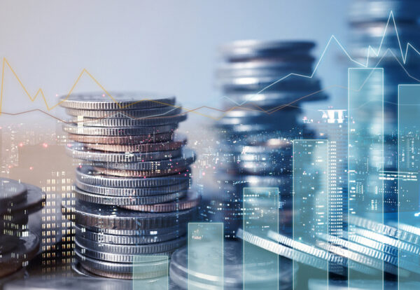 Double exposure of graph and rows of coins for finance and business concept